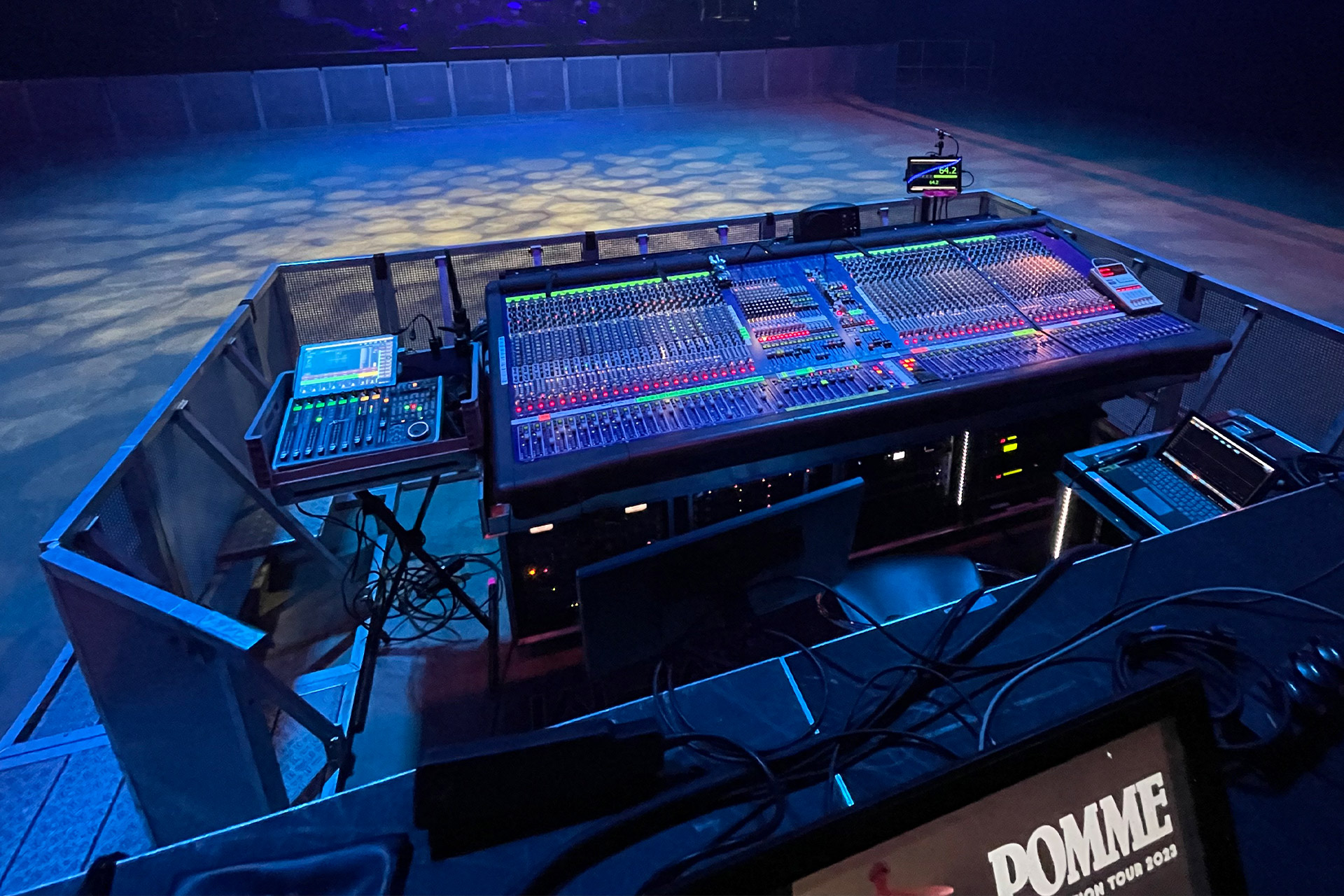 Mixing console in bluish illuminated room